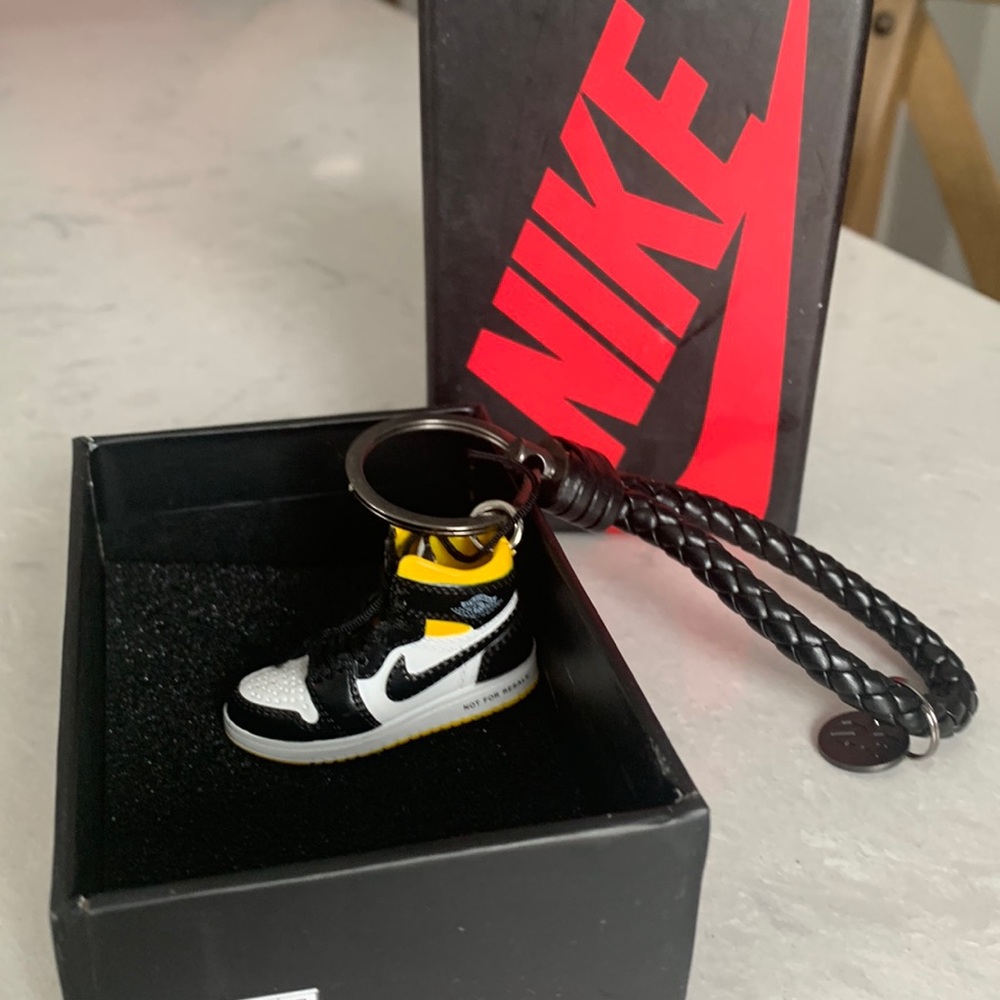 Air Jordan Keychain. New in box. Yellow and black air Jordan’s